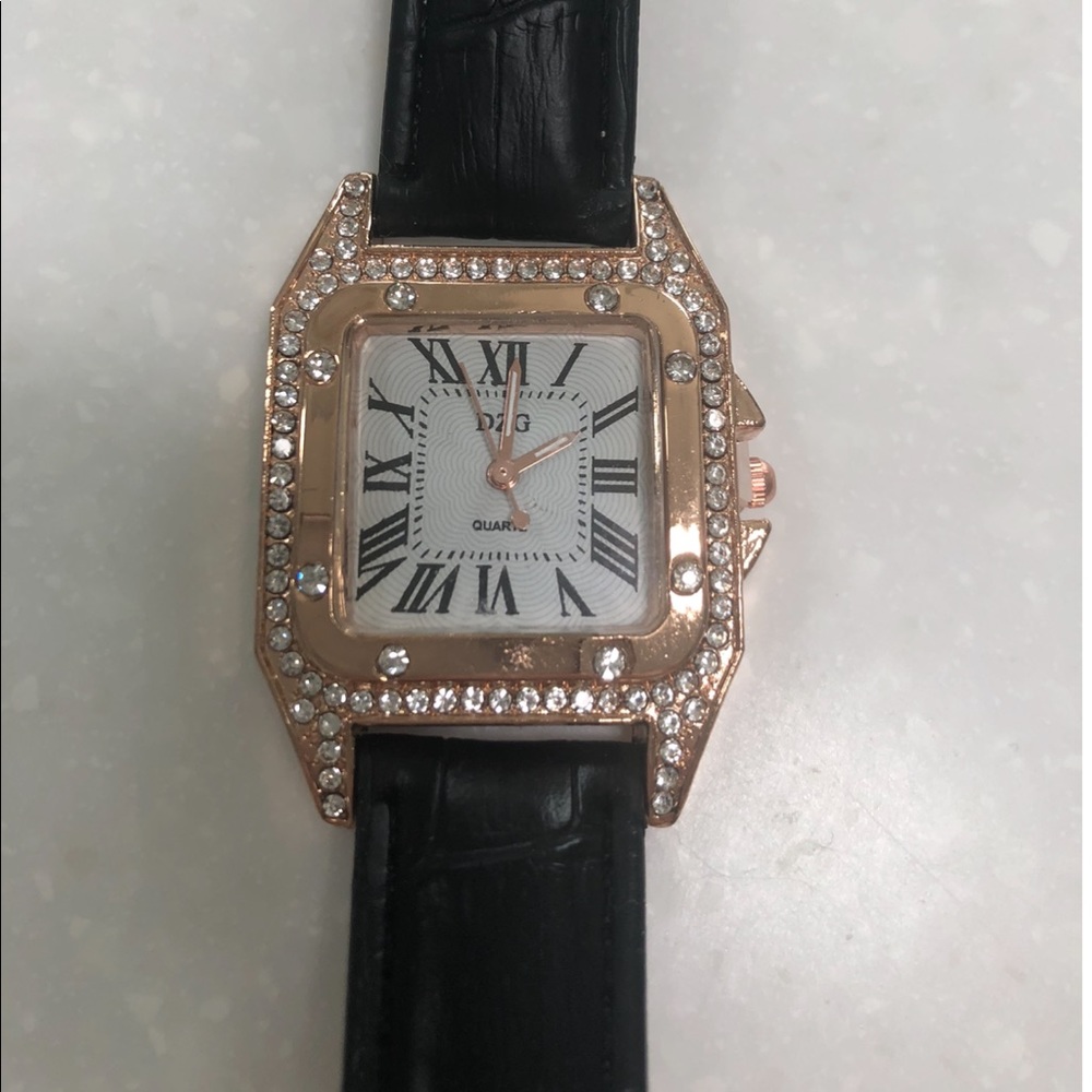 Womans black and gold watch